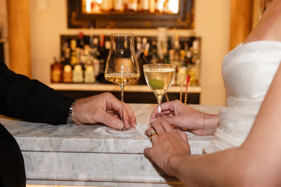 Holly and Matthew’s hands toasting with glasses of wine at the villa bar, at Villa San Michele in Fiesole above Florence, Tuscany, Italy, for an Elopement Collective elopement. Digital photograph by Khara from House of Lucie.