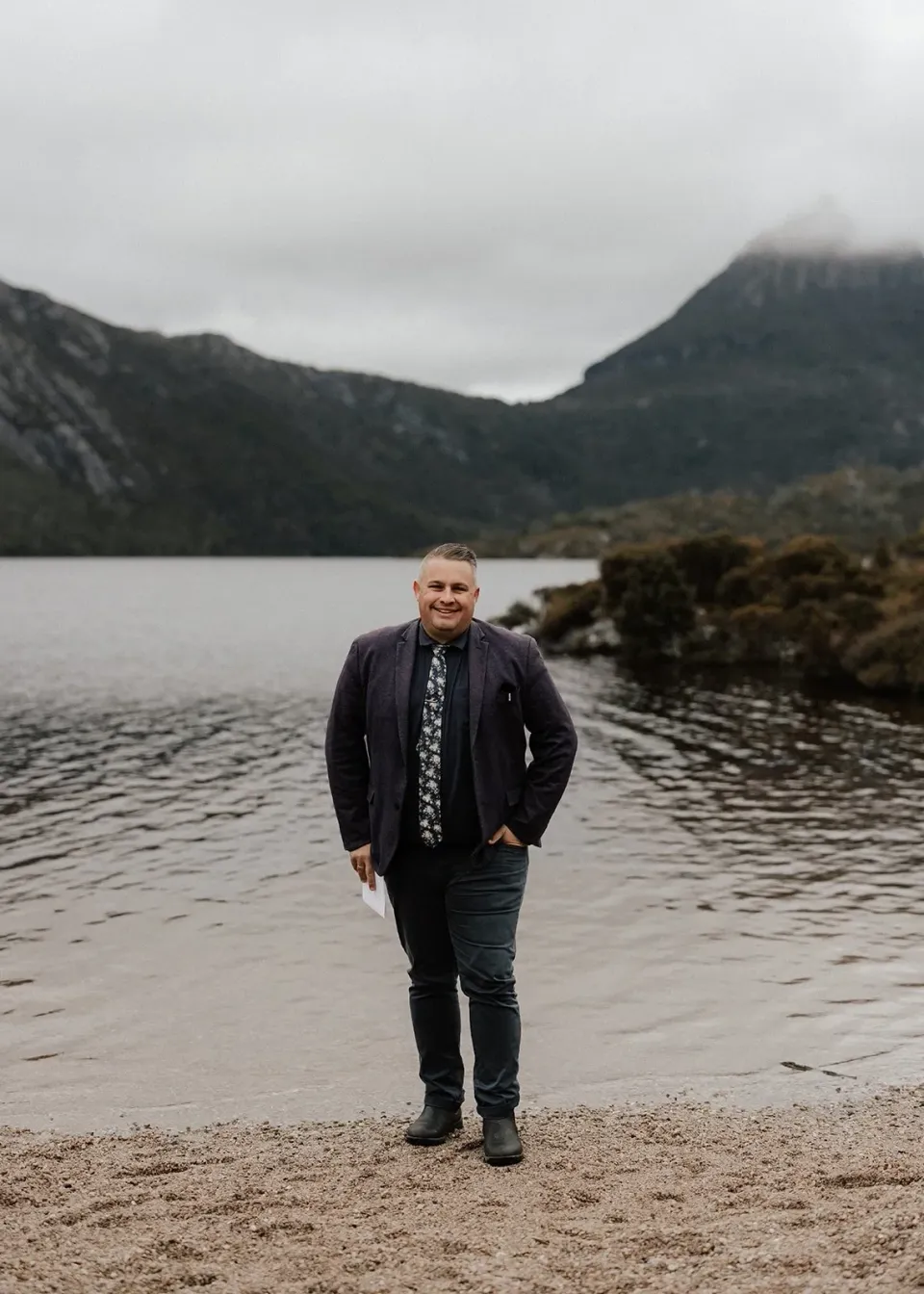 Josh Withers, Tasmanian wedding celebrant on Dove Lake at Cradle Mountain for an elopement with The Elopement Collective