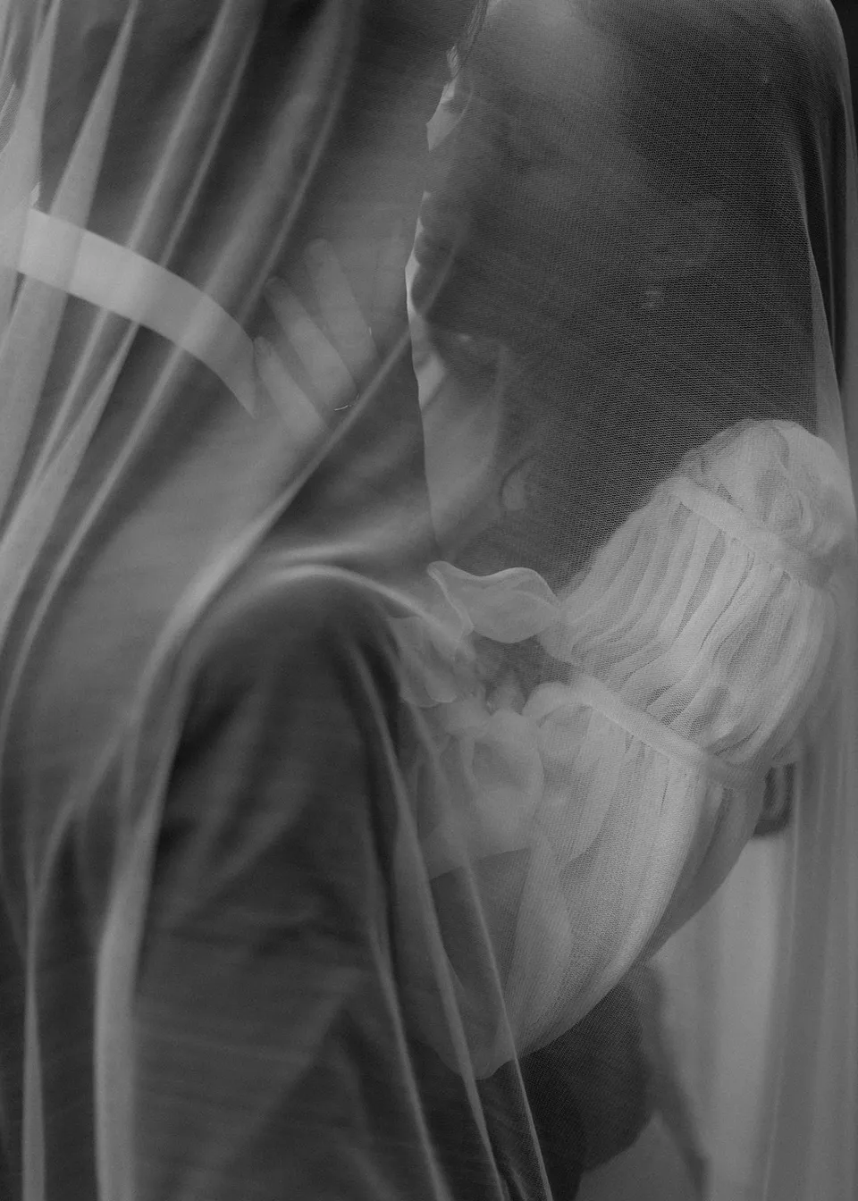 Soft close-up of the couple's faces beneath Elyse's veil. At Fig Tree Villa in Ewingsdale, Byron Bay, for an Elopement Collective elopement. Photograph by Bulb Creative.