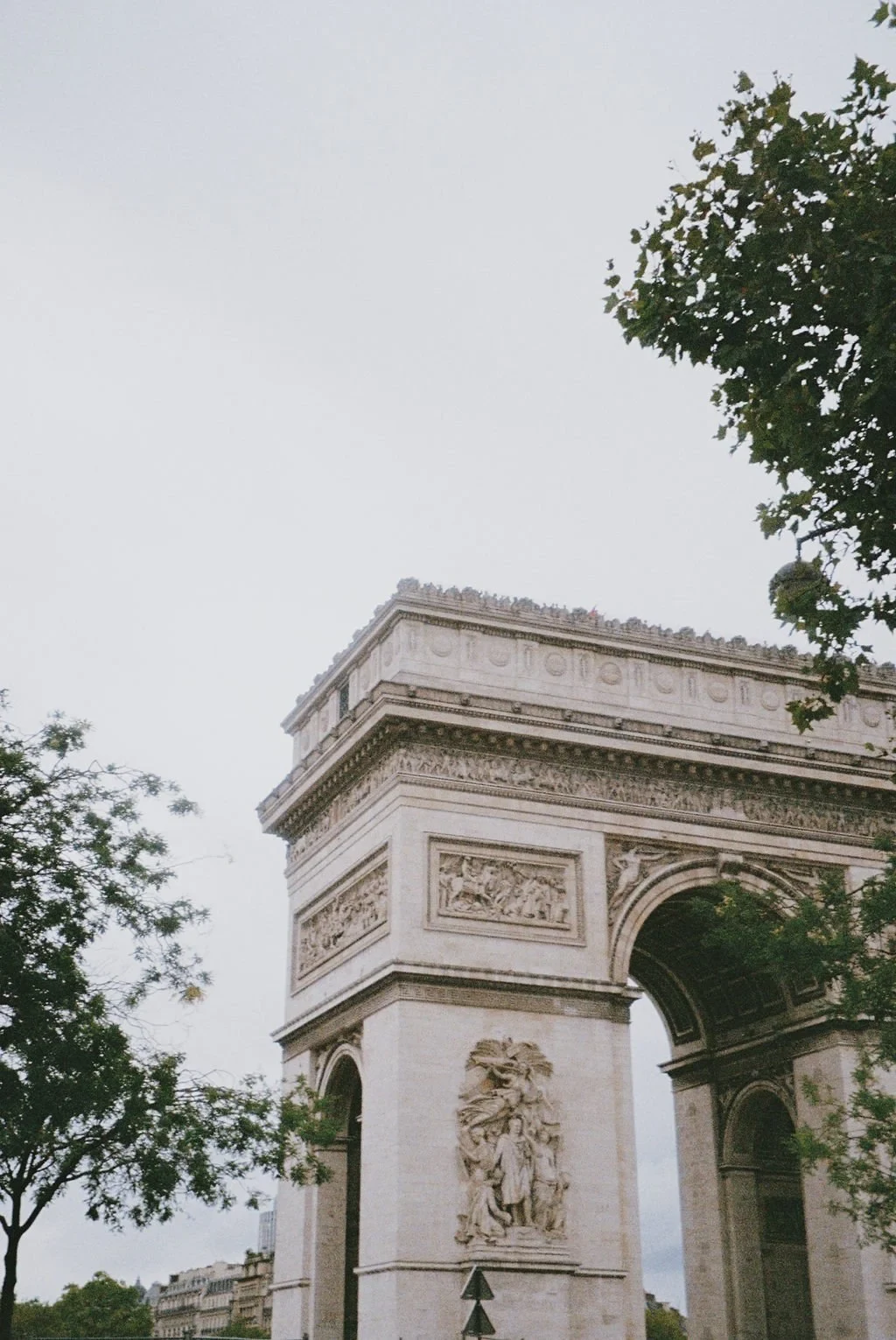 Arc de Triomphe, Paris with trees and overcast sky