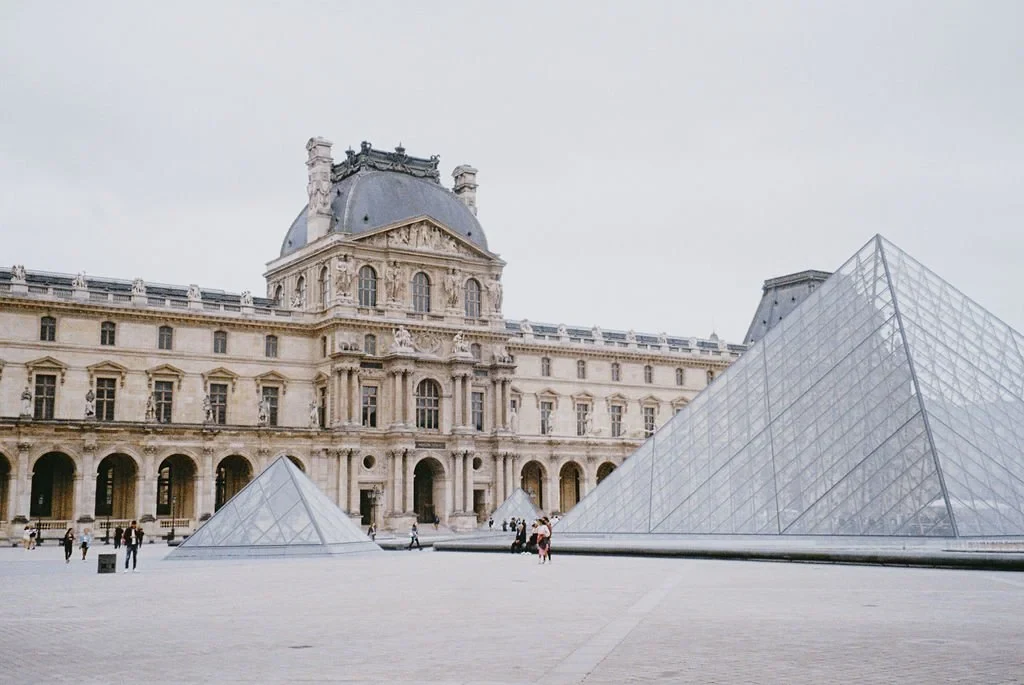 Louvre Museum with glass pyramids in the courtyard, Paris