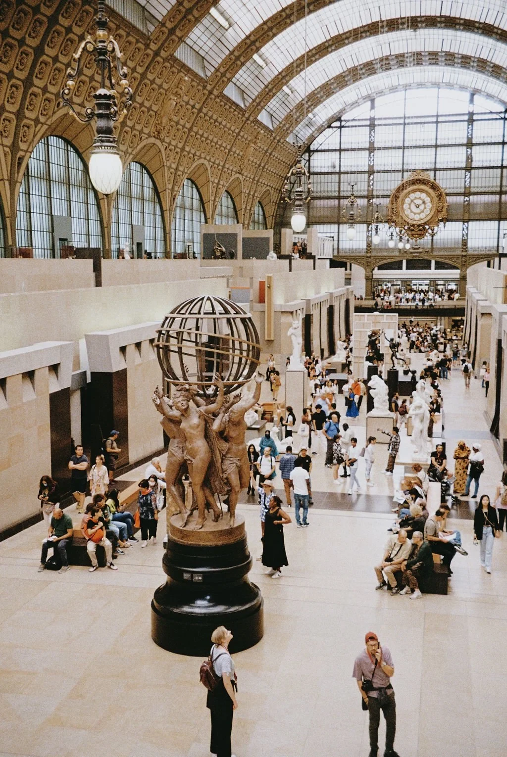 Interior of Musée d'Orsay with sculptures and visitors